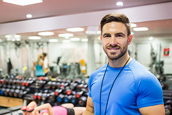 Personal Trainer helping woman. 