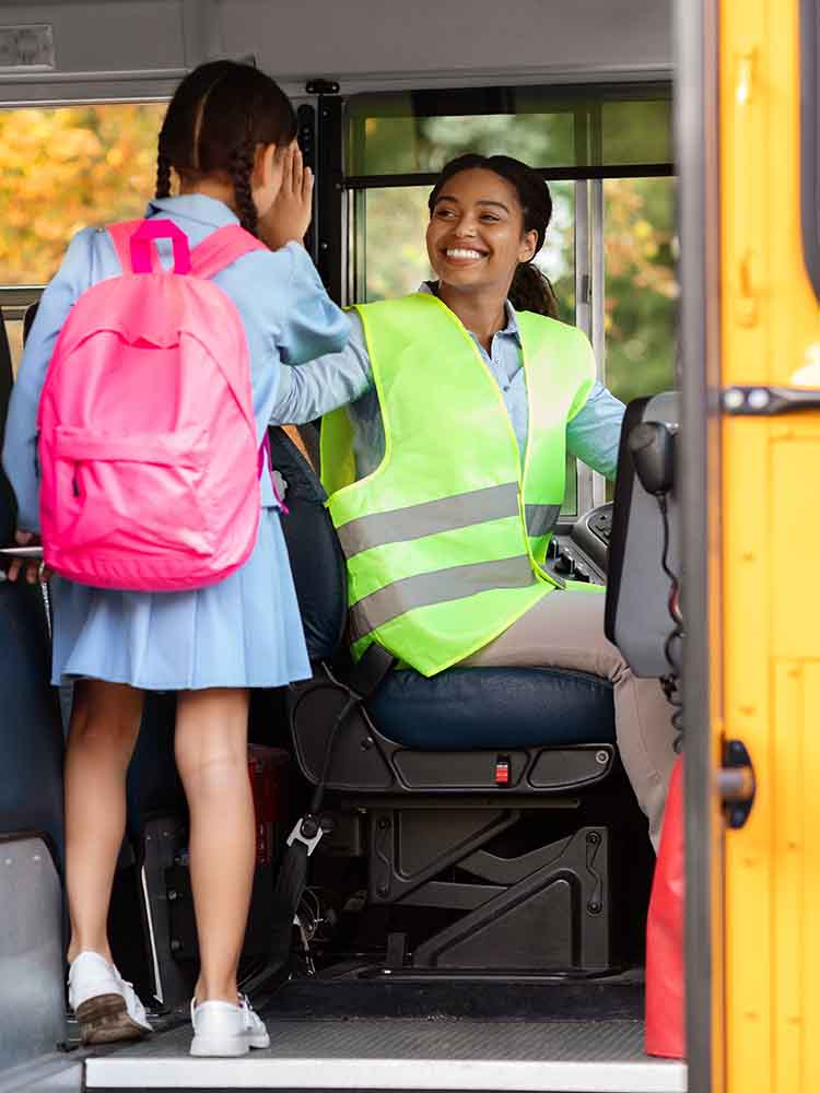 school bus driver with student