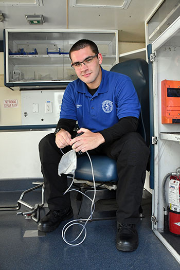 Michael Manthey sitting inside training ambulance at San Jacinto College